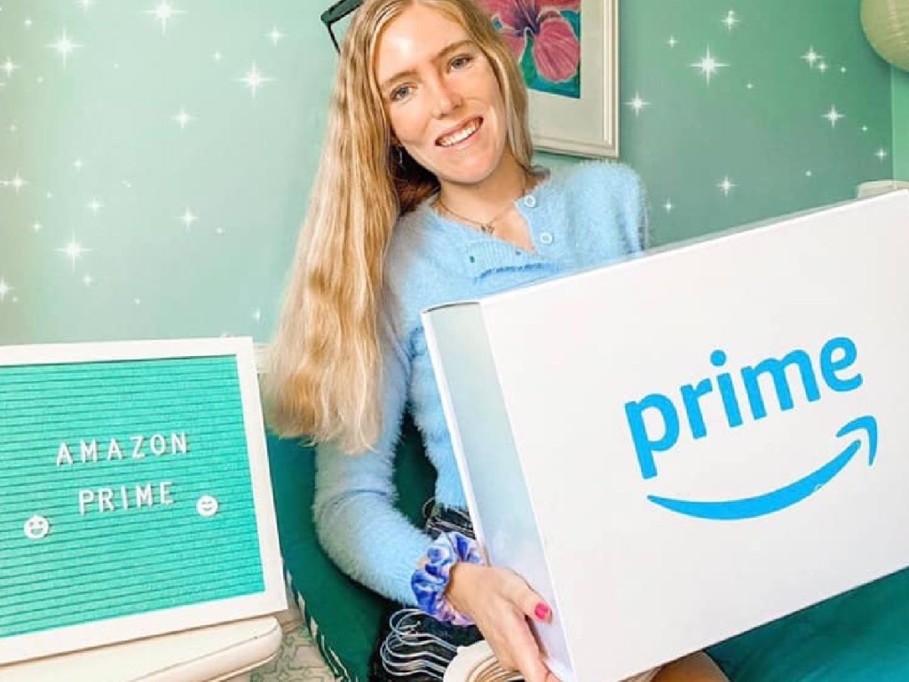 girl holding box in dorm room