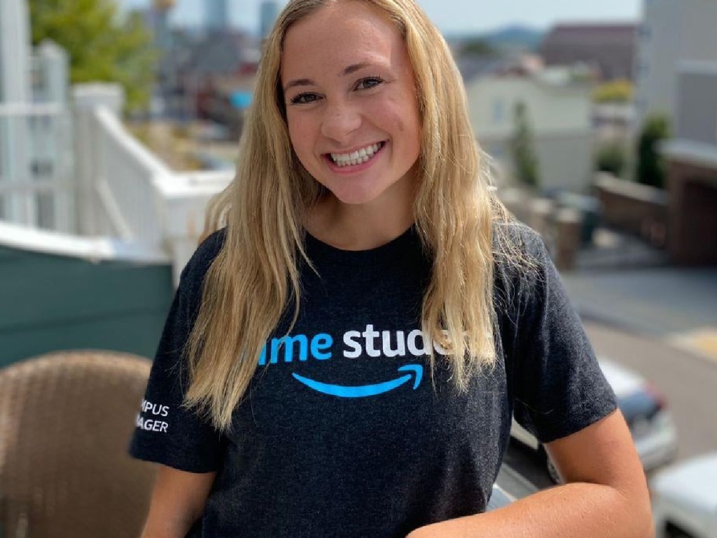 girl smiling with dark t shirt on outside