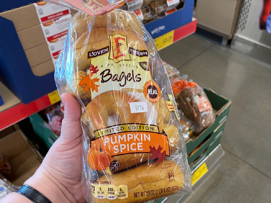 hand holding package of bagels in store