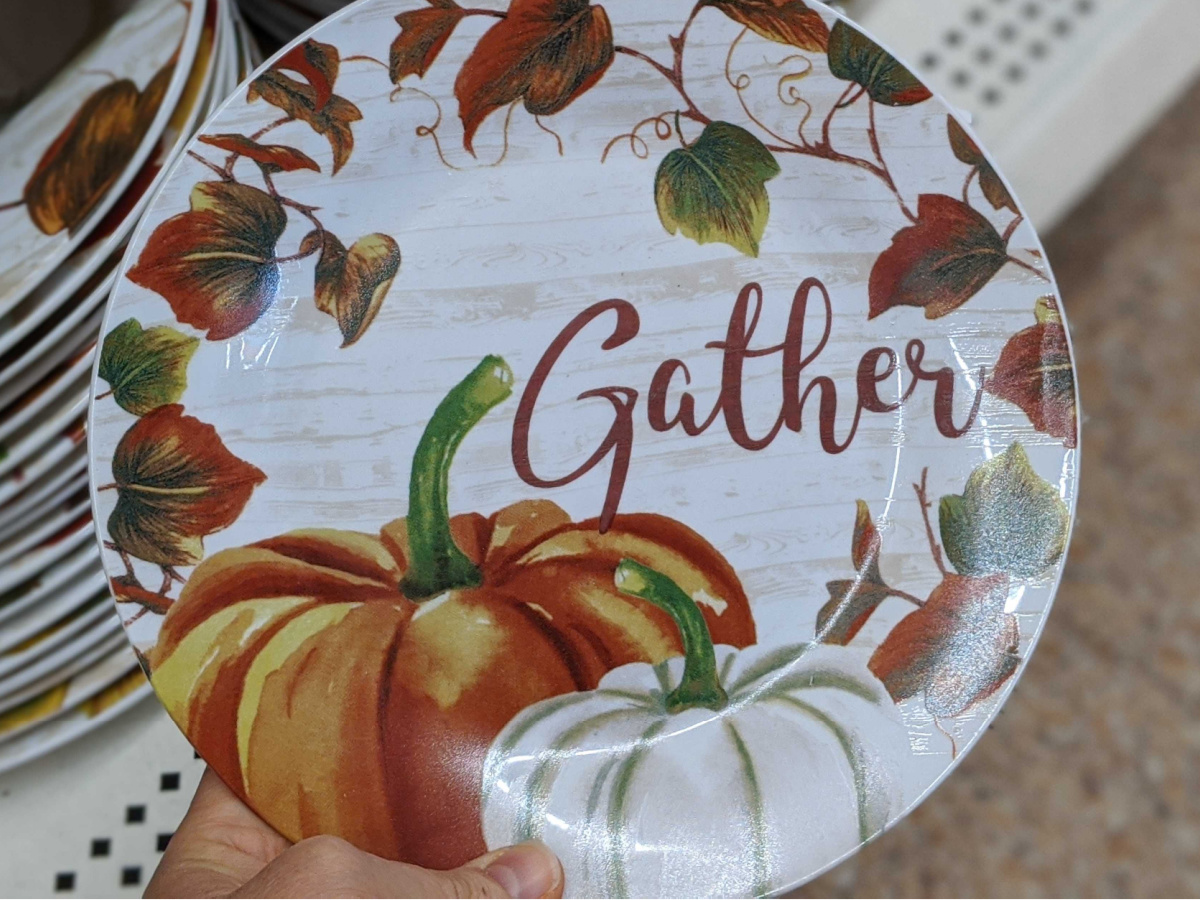 hand holding plate that says Gather on it