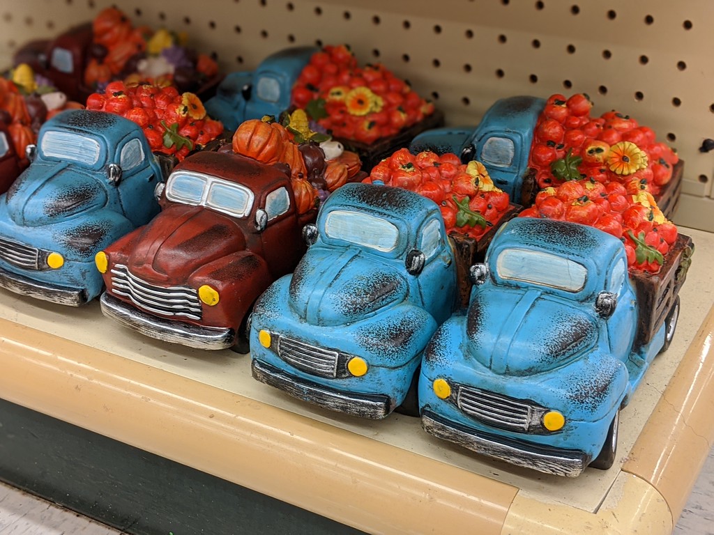 red and blue truck with fall gourds at hobby lobby