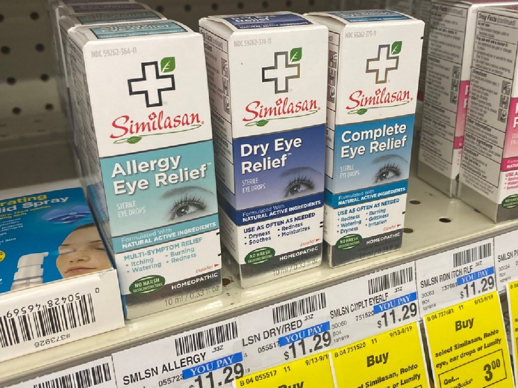 boxes of eye drops on store shelf with price tags
