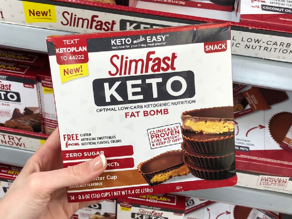 hand holding box of Slimfast brand treats