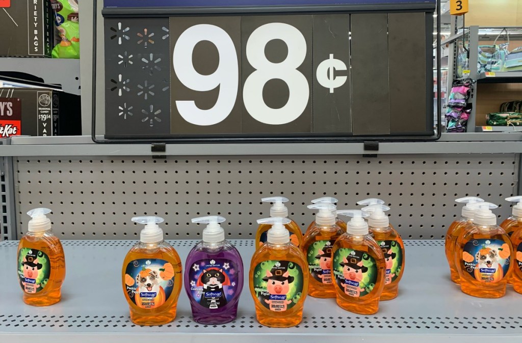 halloween softsoap hand soaps on a walmart shelf with pricing sign