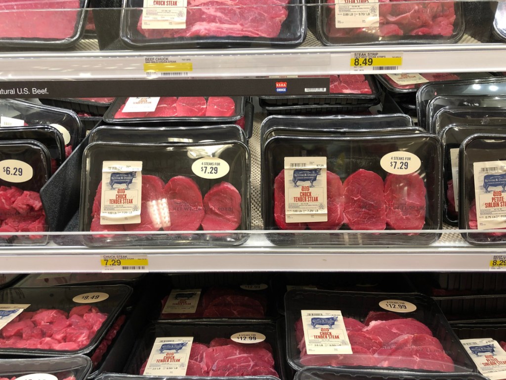 store shelves with packages of steak