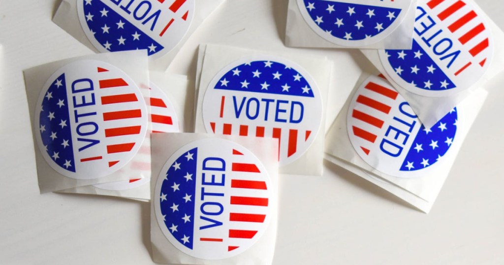 round stickers that say "i voted" on them