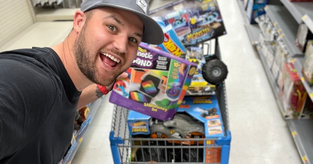 man with cart full of toys at Walmart