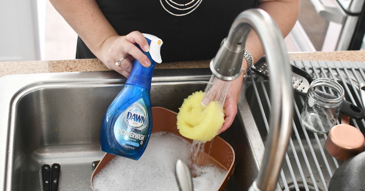 woman washing dishes with Dawn Powerwash