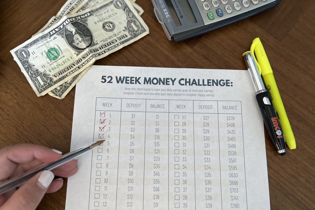 52 week money challenge printed with money and calculator 
