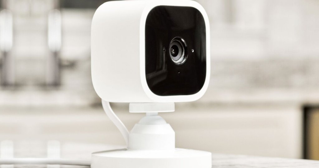 black and white mini security camera on a table