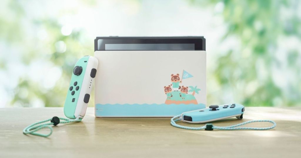 Animal Crossing New Horizons Edition Console on table with trees in background