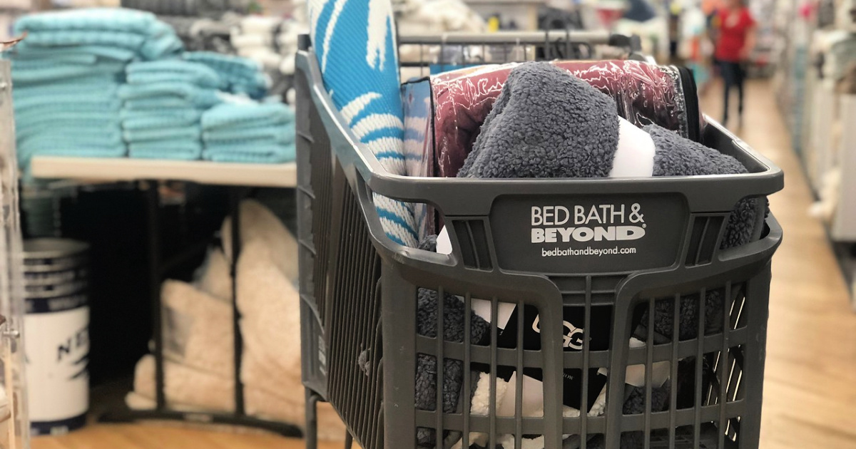 Bed Bath and Beyond shopping cart with rugs in store