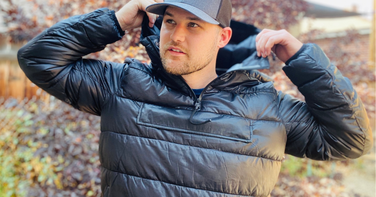 man wearing a black hooded puffer pullover outside