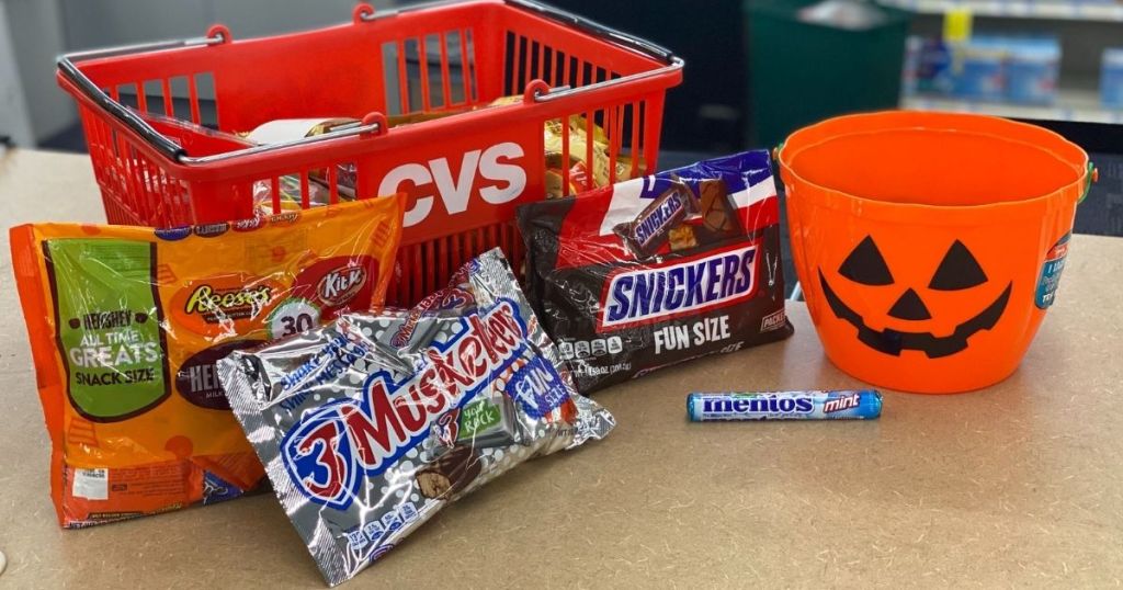 bags of candy next to CVS basket and Halloween bucket