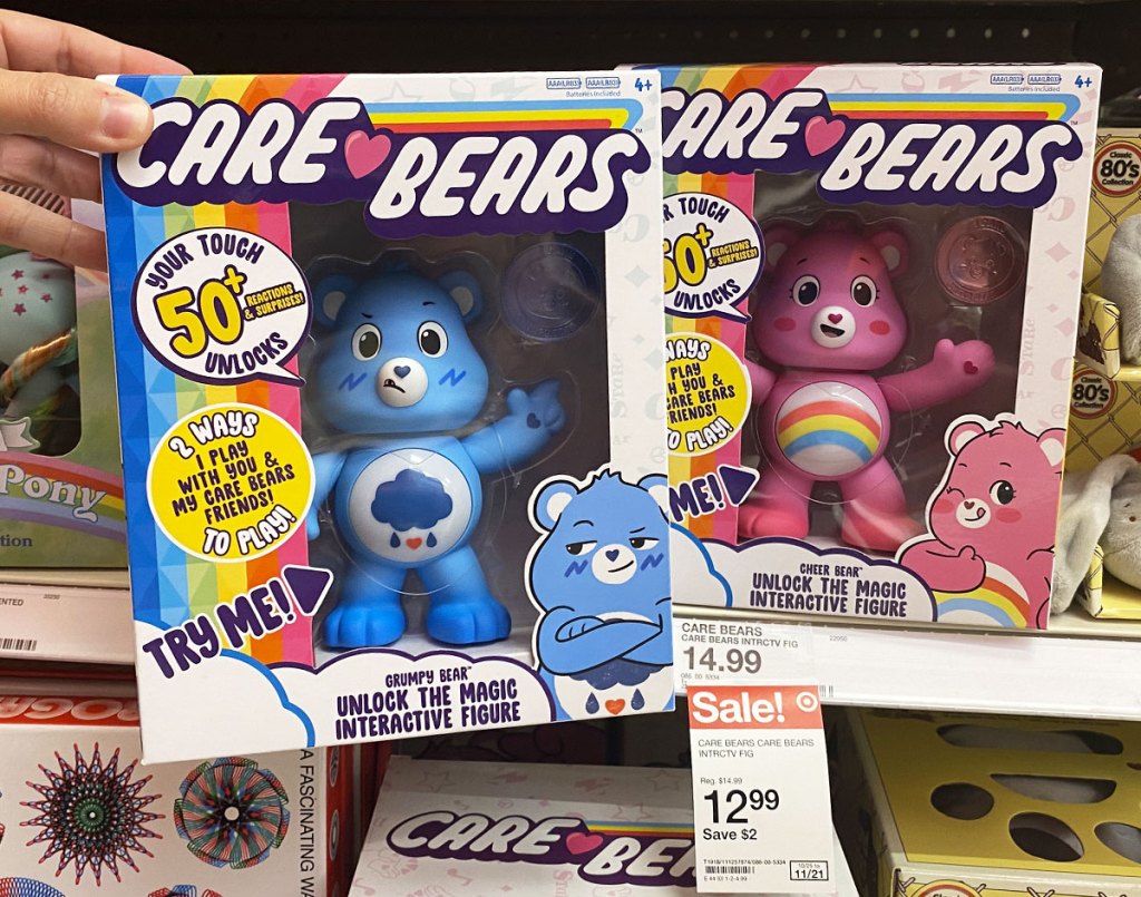 blue and pink care bears interactive toys in retro packaging on target shelf