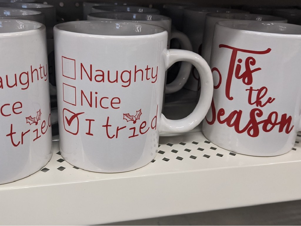 mugs on store shelf with Christmas theme