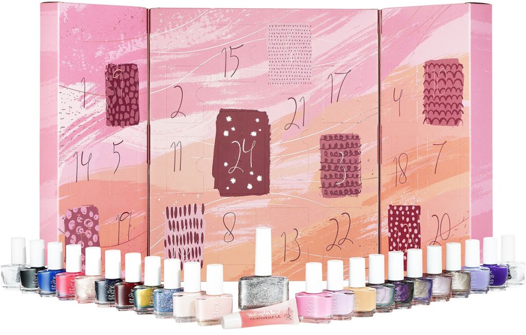 pink advent calendar with mini nail polishes lined up in front of it