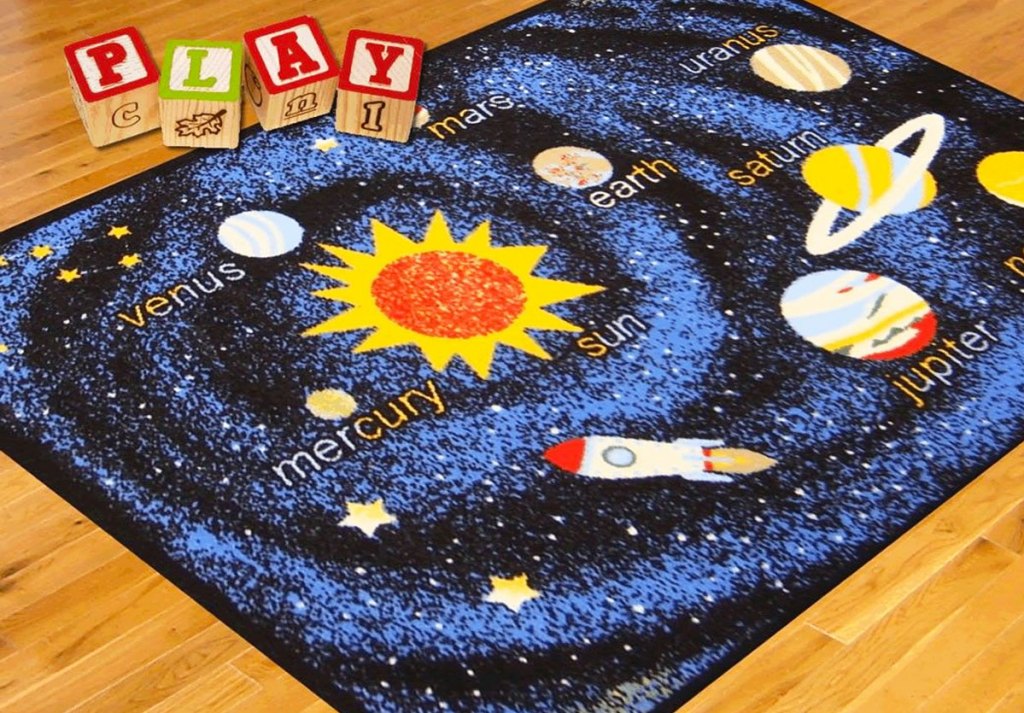 blue solar system printed area rug on wood floor