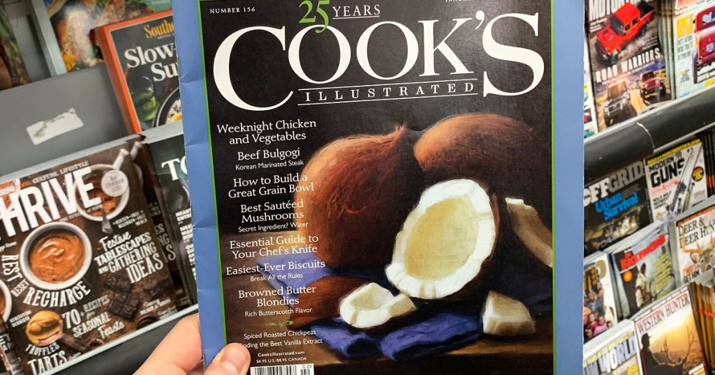 person holding up an issue of cooks magazine with coconuts on front cover