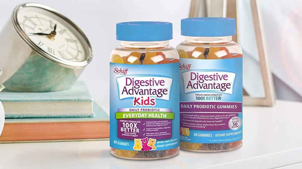 two blue bottles of adult and kids digestive advantage gummies on nightstand