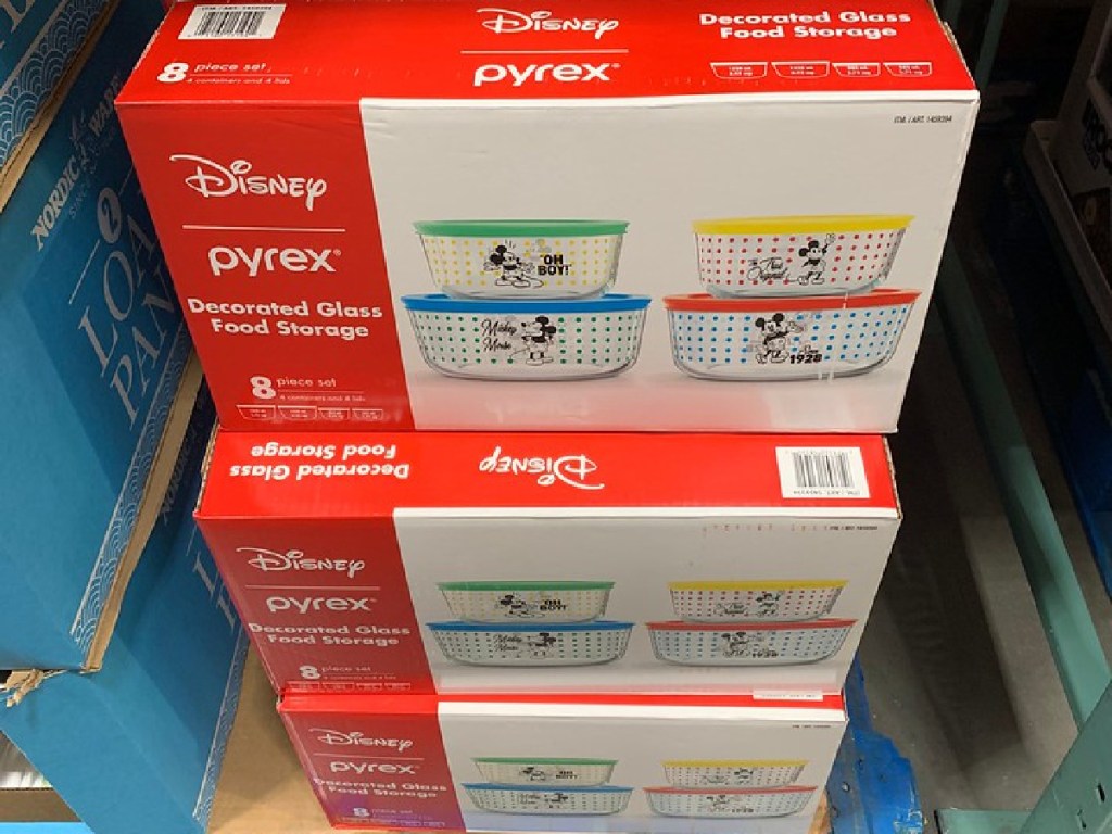 Mickey Mouse themed Pyrex food storage sets stacked on floor in store