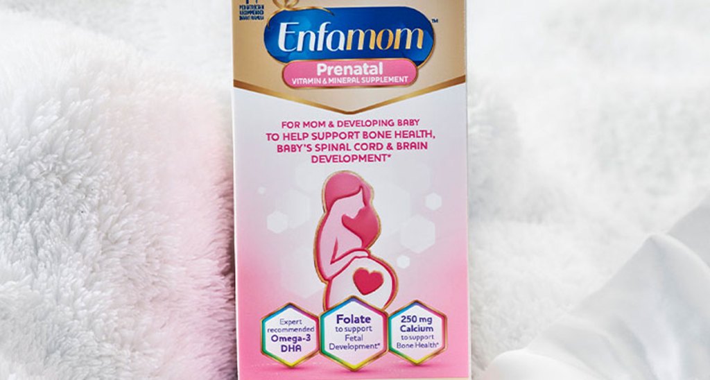 whit and pink box of enfamil prenatal tablets in fuzzy baby blanket