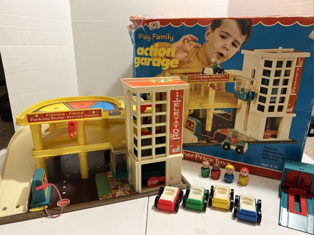 The Family Action Garage, one of the most valuable Vintage Fisher Price Toys on display with original box