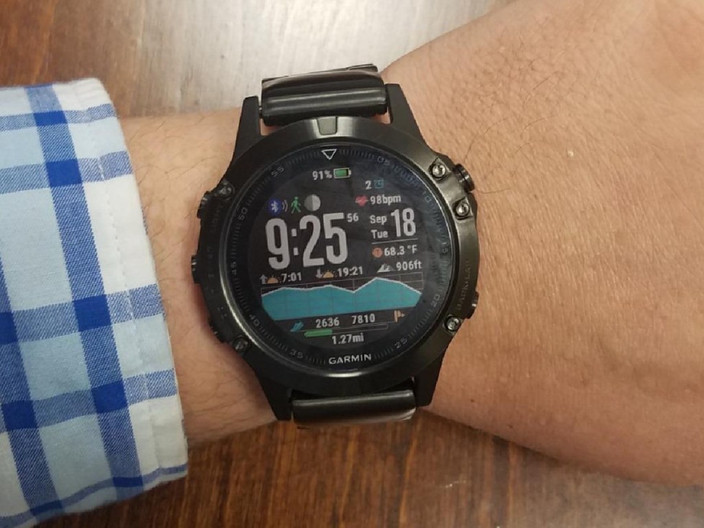 man wearing a garmin fenix 5 smartwatch