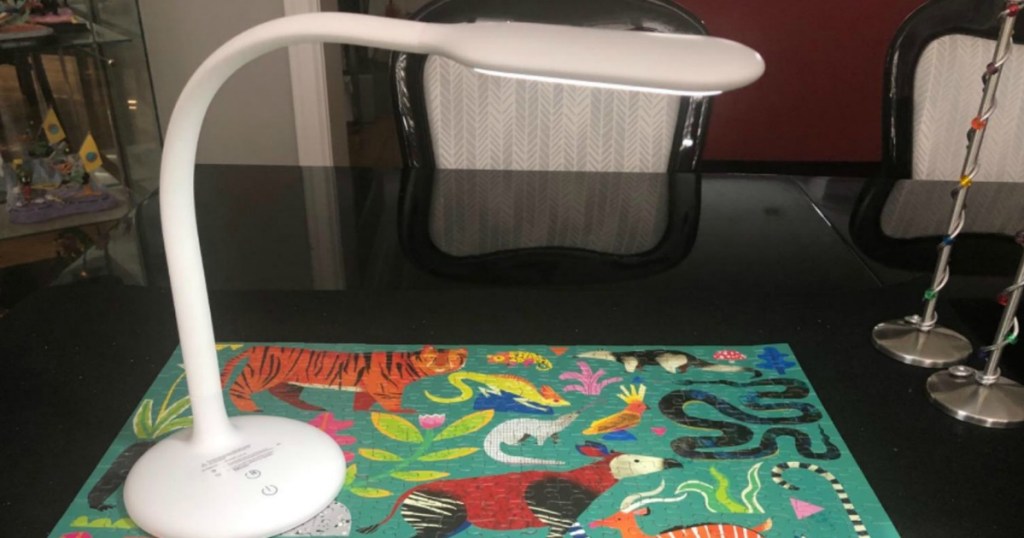 Gladle Cordless LED Desk Lamp over a puzzle