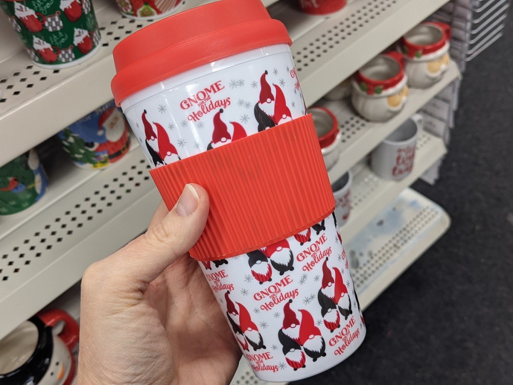 hand holding Christmas themed cup