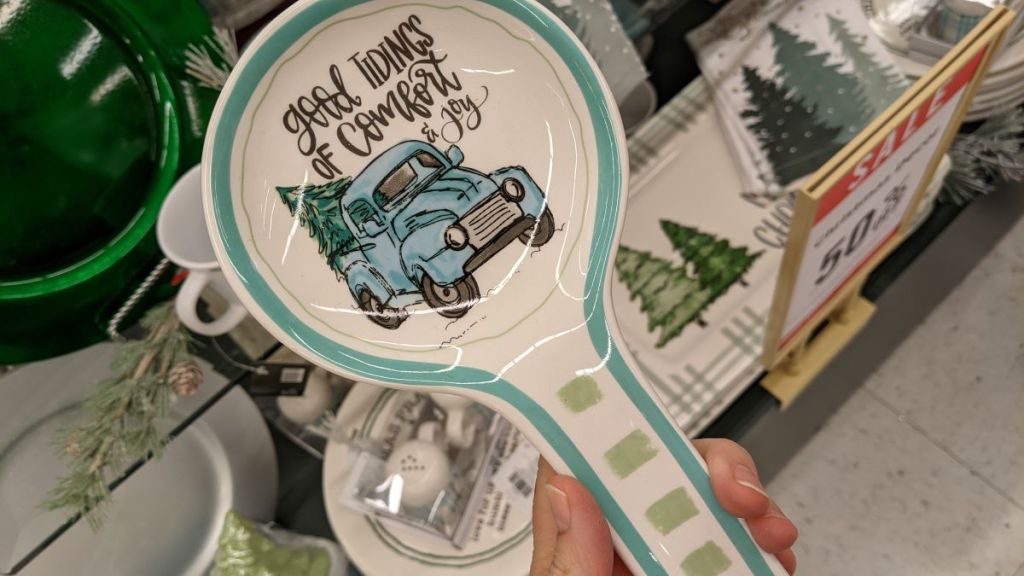 hand holding a Good Tidings Blue Truck Spoon Rest