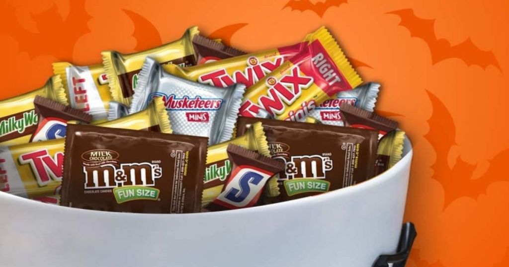 bowl of Halloween candy with orange background