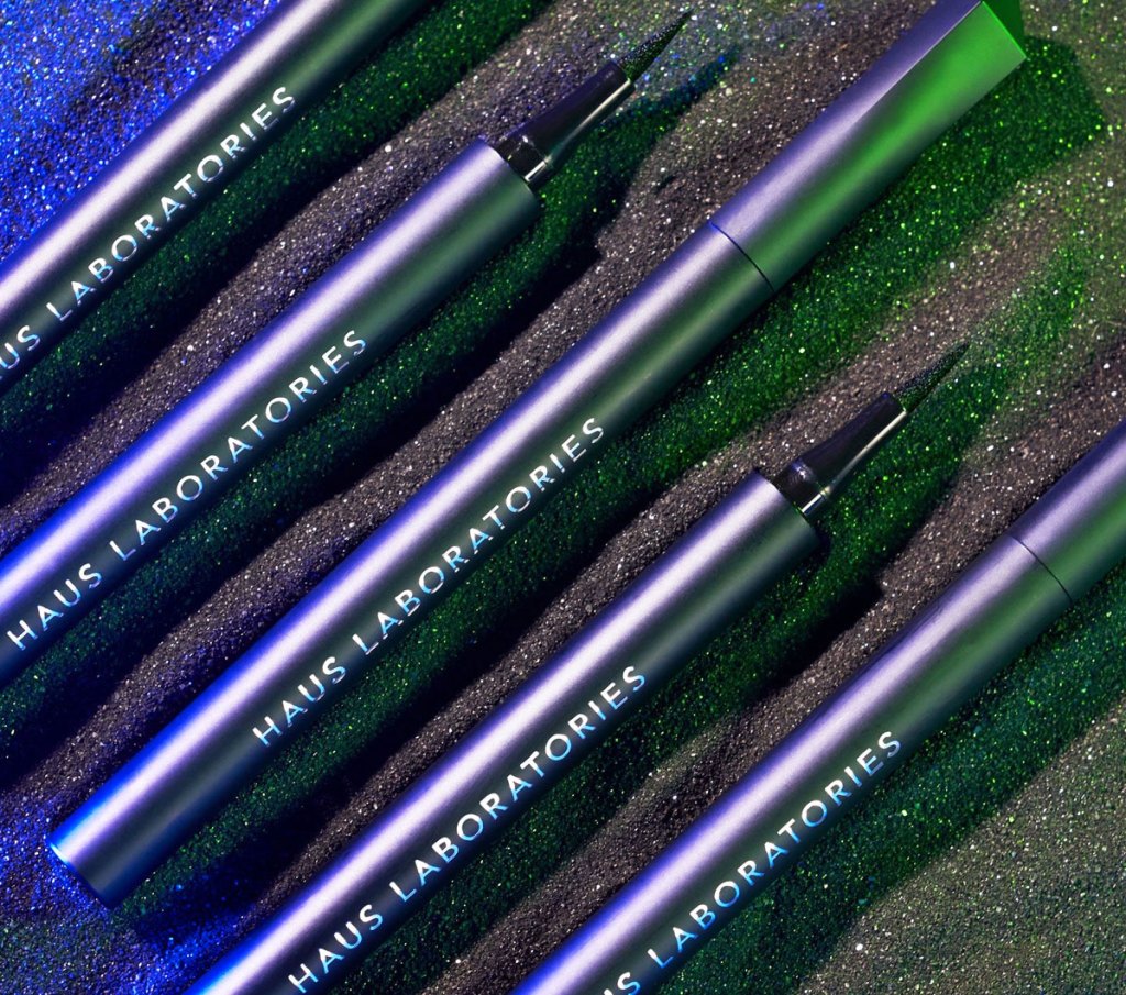 haus laboratories liquid eye liners lined up next to each other on black background