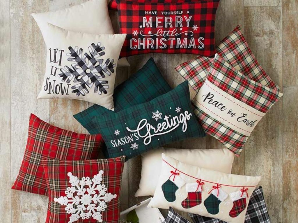 holiday accent pillows with plaid styles and holiday graphics