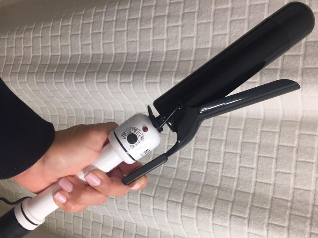 Woman Holding a Hot Tools Curling Iron
