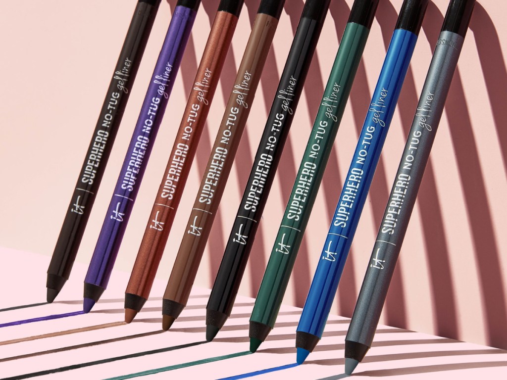 different colored eyeliners leaning against wall