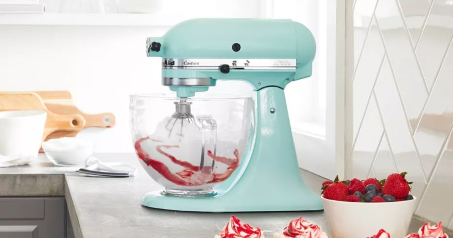 KitchenAid Stand Mixer Bundle with Flex Edge Beater and Glass Bowl sits on your kitchen counter next to your baked goods.
