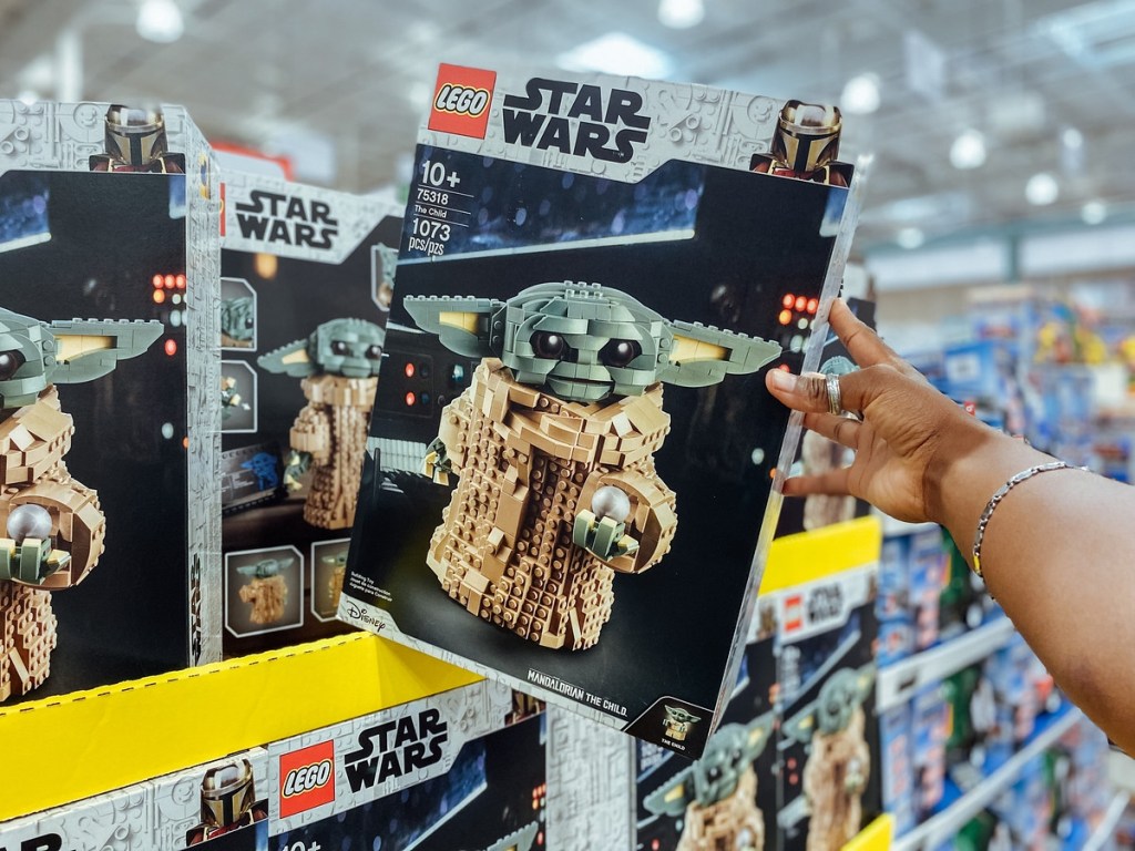 holding a Star Wars Lego set
