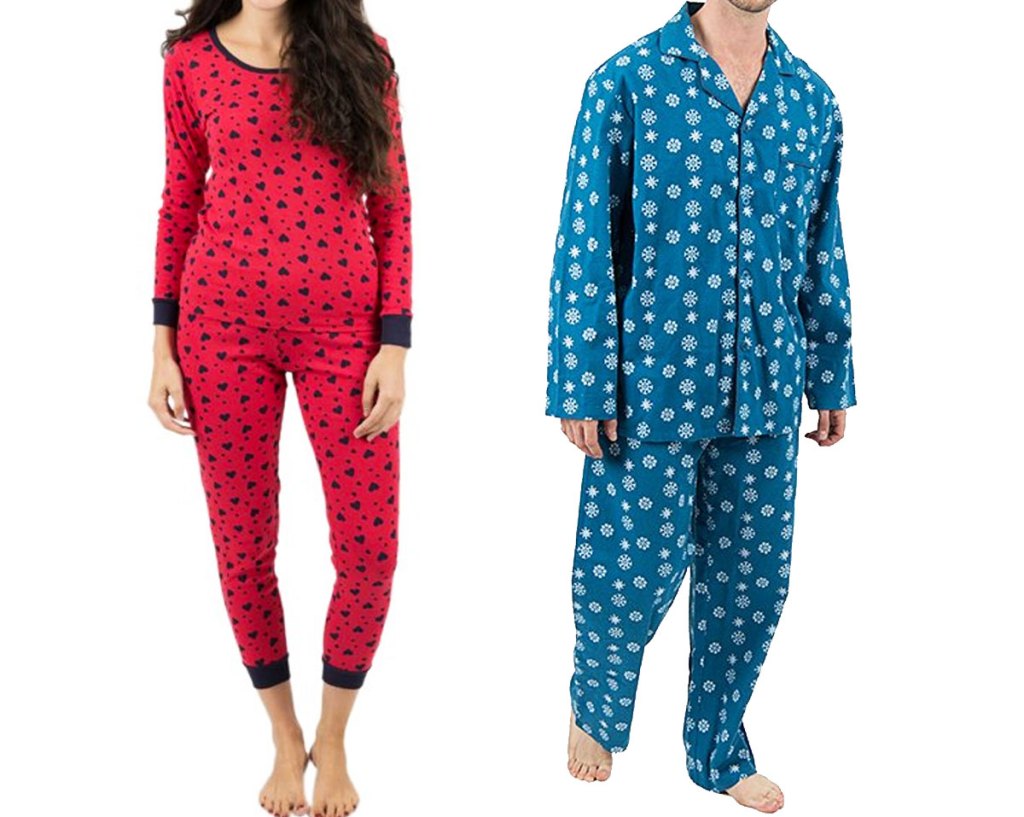 woman in red heart print pajama set and man in blue snowflake pajama set