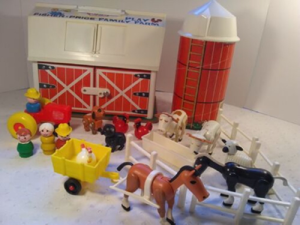 Vintage Fisher Price Barn Playset and pieces on display