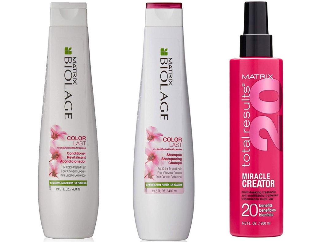white and pink bottles of matrix biolage shampoo and conditioner and a pink bottle of styling spray