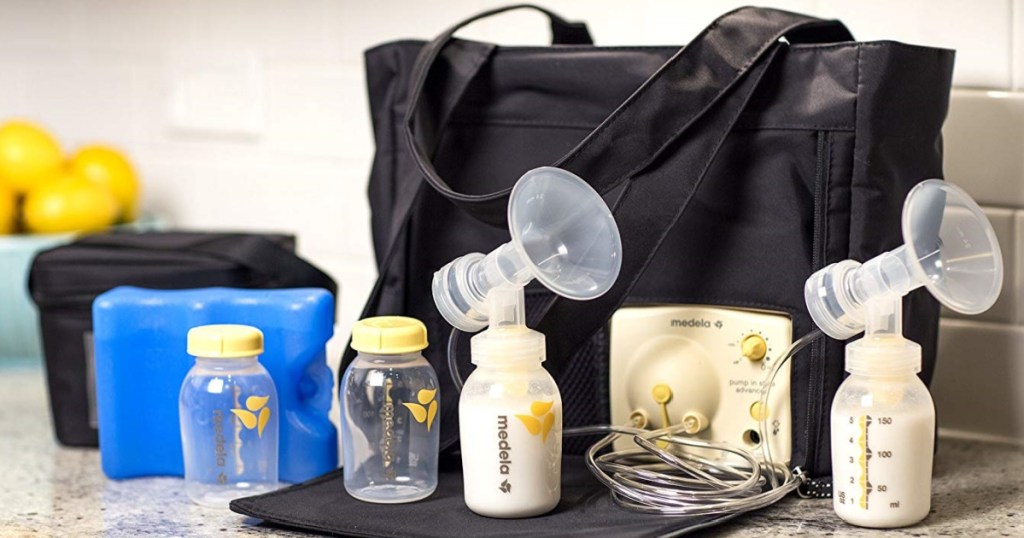 breast pump, black tote bag, bottles with milk on counter