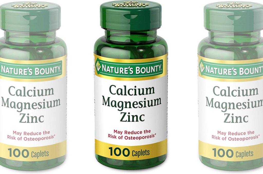 three green bottles of Nature's Bounty calcium magnesium & zinc supplement