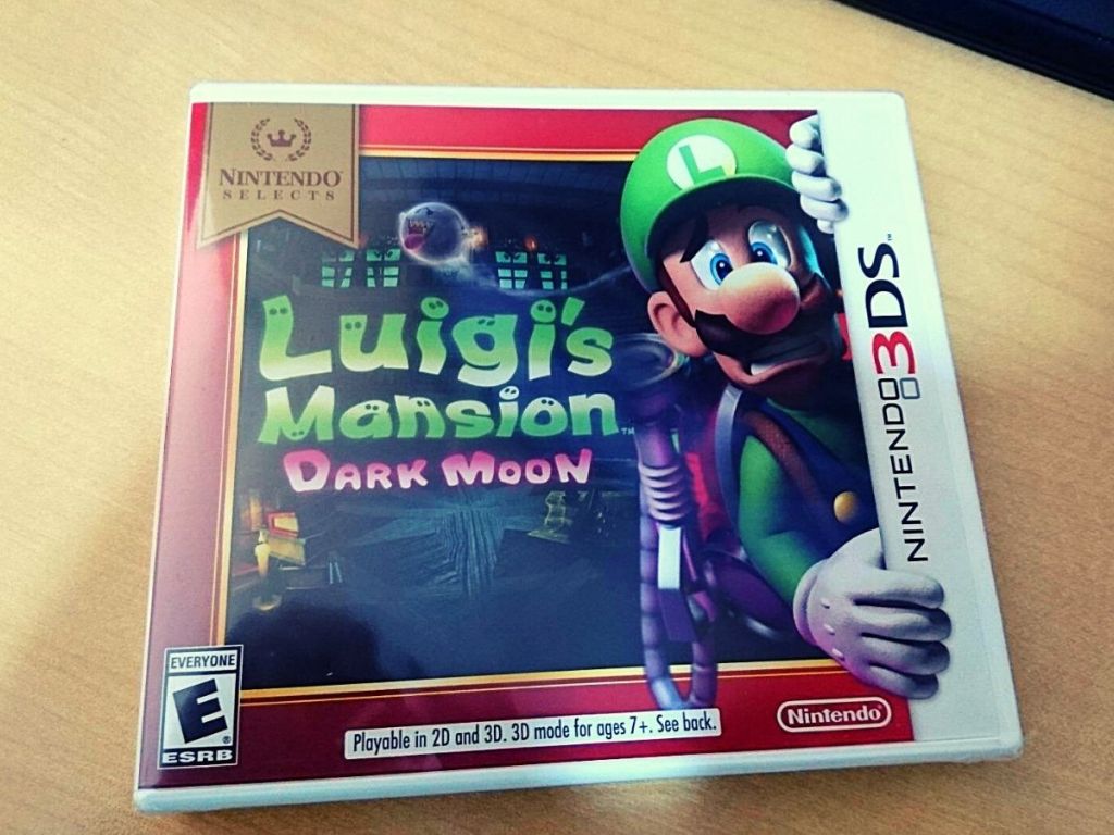 Nintendo 3DS Luigi's Mansion video game on table 