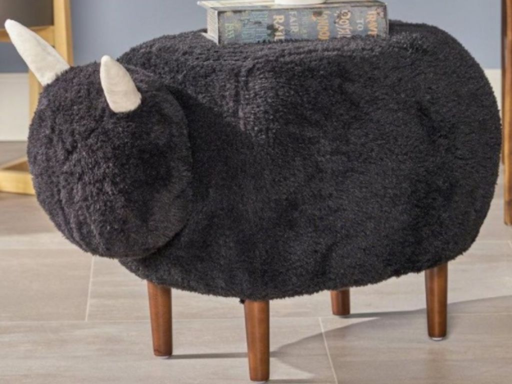 Upholstered sheep ottoman