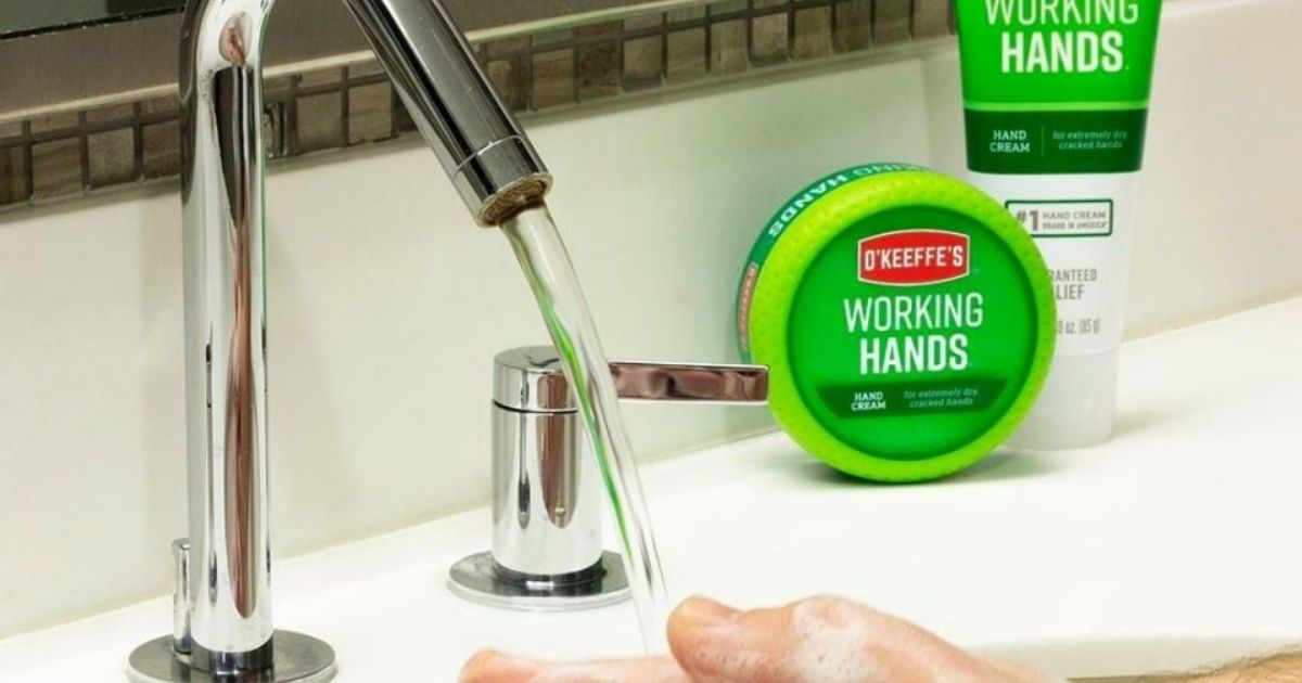 O'Keeffe's washing hands in sink with faucet