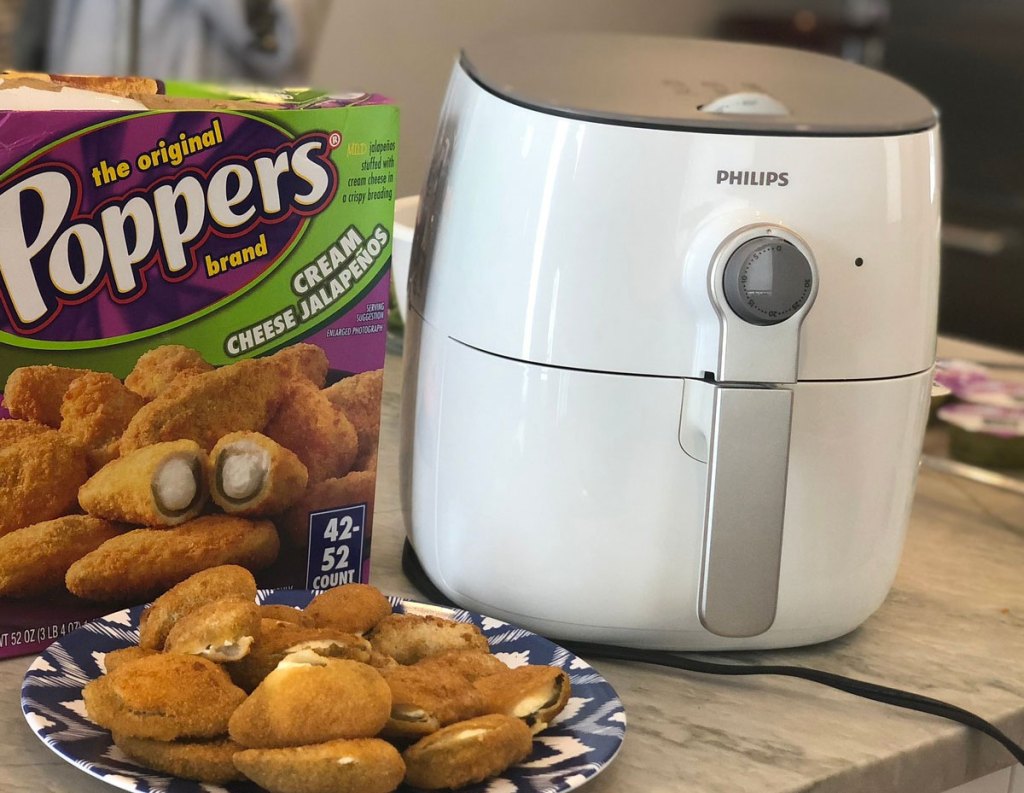 white Phillips air fryer on kitchen counter next to jalapeno poppers