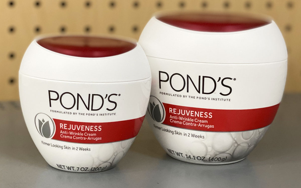 two white and red jars of Pond's Rejuveness Anti-Wrinkle Cream on grey shelf