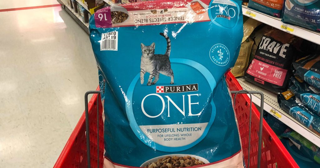 blue bag of purina one cat food in a red target shopping cart