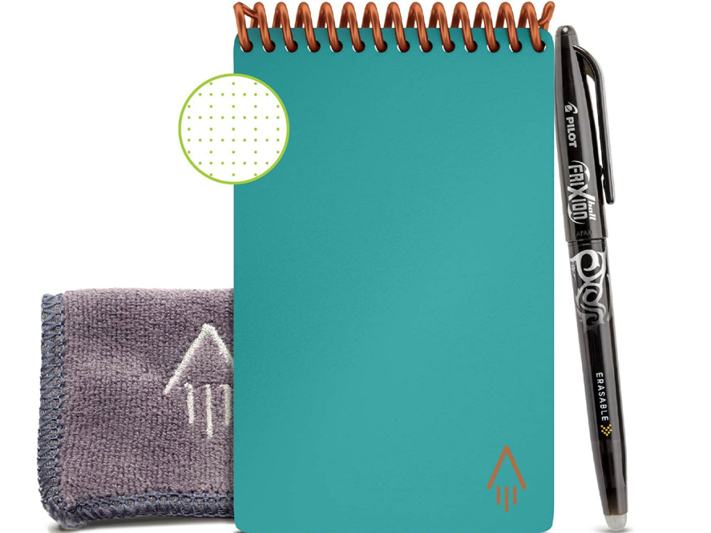 Light blue smart notebook next to cleaning pad and pen